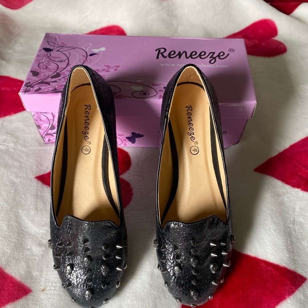 Barley worn black flats with spikes